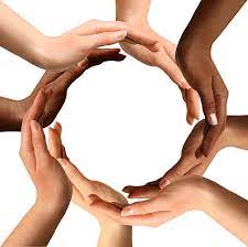 Eight hands in many different skin tones form a circle.